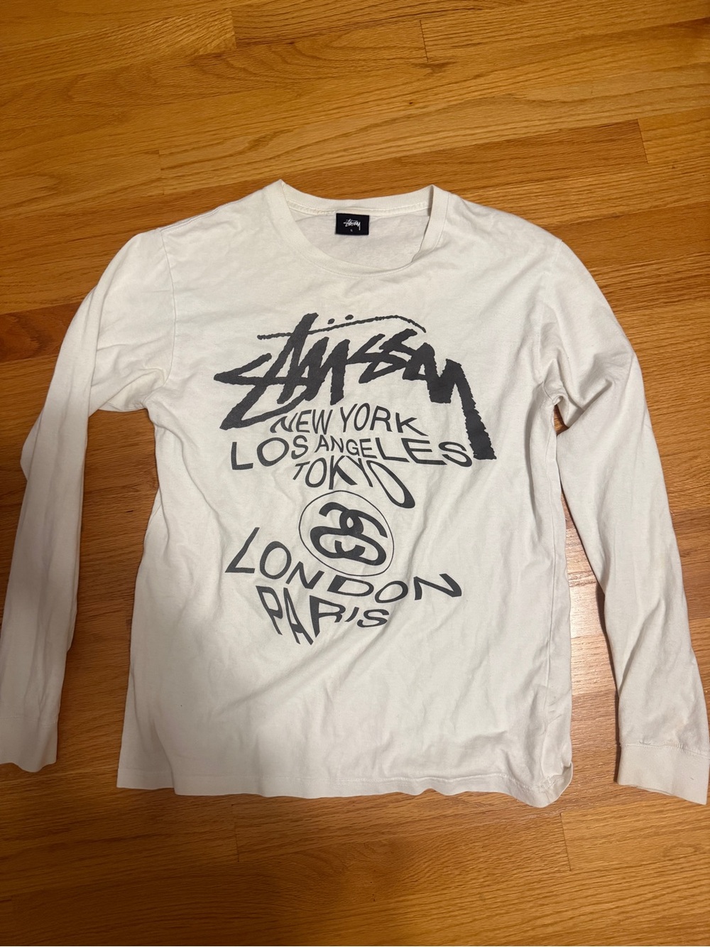 Stussy White Long Sleeve Tee with Black Graphic Logo